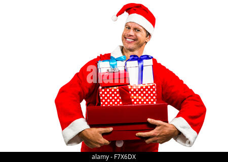 Homme heureux en costume père noël avec des cadeaux Banque D'Images