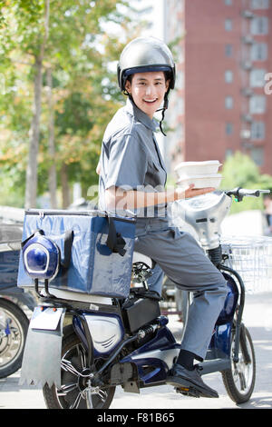 Livreur à emporter Banque D'Images