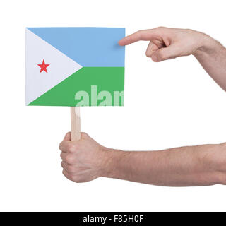 Main tenant petite carte, isolé sur blanc - Pavillon de Djibouti Banque D'Images