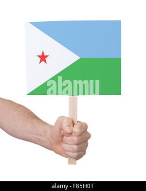 Main tenant petite carte, isolé sur blanc - Pavillon de Djibouti Banque D'Images