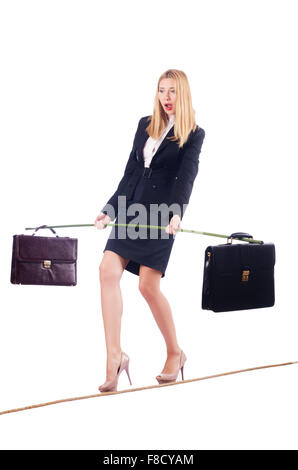 Businesswoman walking sur corde raide isolated Banque D'Images