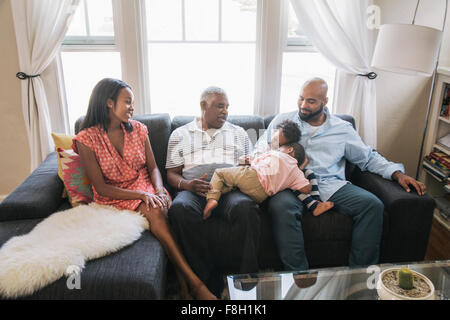 African American family relaxing on sofa Banque D'Images