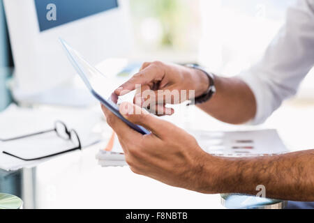 Close up of man using tablet Banque D'Images