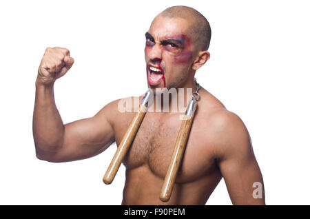 Homme avec nunchucks isolated on white Banque D'Images