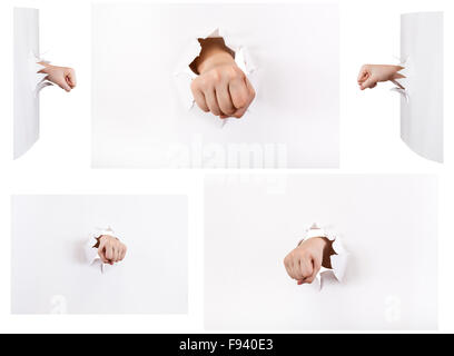 L'ensemble d'un mur de papier perforé poings isolé sur fond blanc Banque D'Images