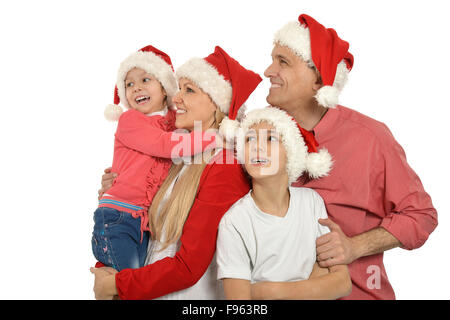 Le port de bouchons de vacances de Noël en famille Banque D'Images