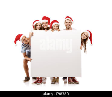 Groupe de jeunes gens de santa hats avec copie espace, isolé sur fond blanc Banque D'Images