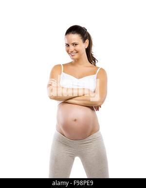 Portrait d'une belle jeune femme enceinte prête à l'exercice, isolé sur fond blanc Banque D'Images