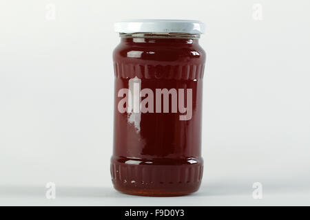 Pot de miel. Friandise au miel dans un bocal en verre et cire d'abeilles. Banque D'Images