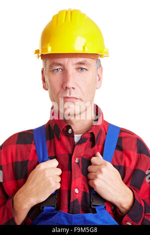 Personnes âgées construction worker with hard hat jaune Banque D'Images