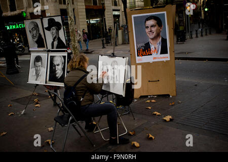 Barcelone, Espagne. 25Th Dec 2015. Ciudadanos chef du parti, Albert Rivera, candidat pour les prochaines élections générales, le 20 décembre est vu à une affiche de campagne proche d'un peintre de la rue de La Rambla de Barcelone, Espagne, le 17 décembre, 2015. Crédit : Jordi Boixareu/Alamy Live News Banque D'Images