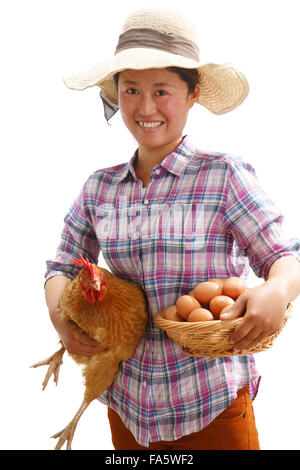L'agriculteur a pris l'oeuf et la poule Banque D'Images