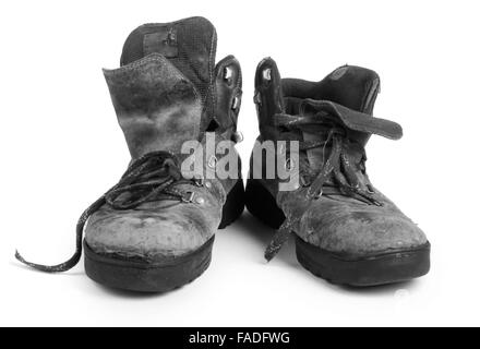 Old dirty boots sur fond blanc Banque D'Images