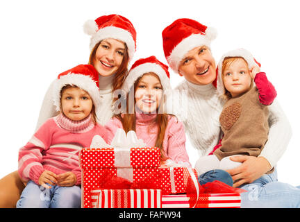 Grande famille à Santa hat with presents Banque D'Images