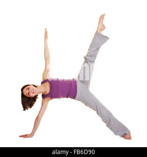 Young smiling woman stretching ses jambes flexibles Banque D'Images