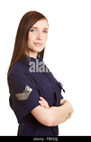 Jeune femme agent de police smiling with arms crossed Banque D'Images