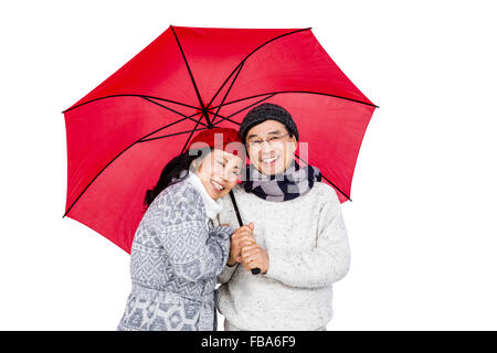 Older asian woman under umbrella Banque D'Images