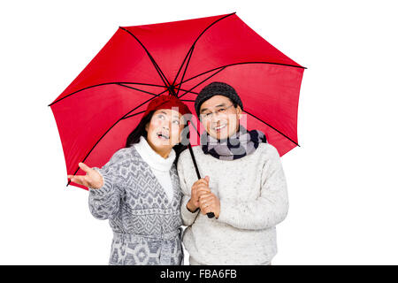 Older asian woman under umbrella Banque D'Images