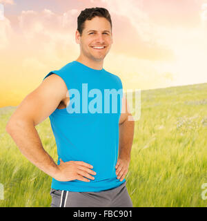 Image composite de portrait of a smiling young man fit Banque D'Images