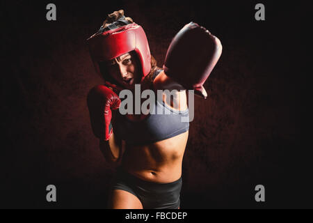 Image composite de boxer avec des gants de boxe et coiffures Banque D'Images