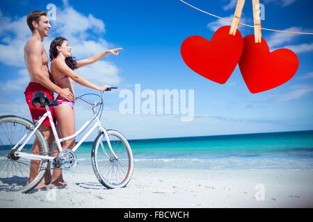 Image composite de l'heureux couple going on a bike ride Banque D'Images