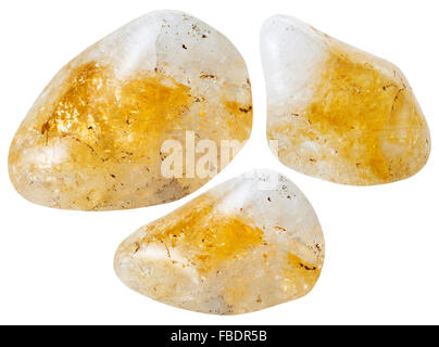 La prise de vue macro des pierres minérales naturelles - trois pierres quartz citrine jaune isolé sur fond blanc Banque D'Images