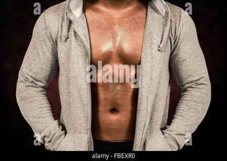 Image composite de l'homme musclé en avec capuchon Banque D'Images