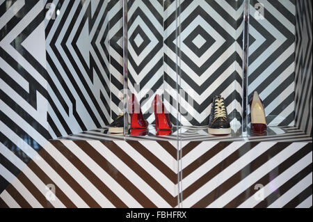 Shoe Designer Christian Louboutin launches new boutique selling his  trademark red-soled shoes inside Selfridges,Manchester Stock Photo - Alamy