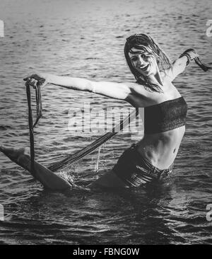 Young Woman Enjoying In Sea
