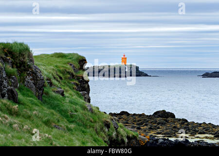 Le phare sur l'île de Flatey, petite île, l'Islande, l'Europe. Banque D'Images