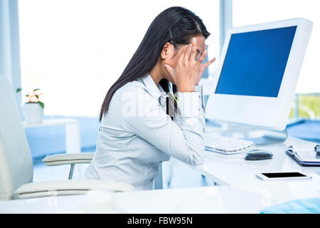 Of Asian businesswoman with hands on face Banque D'Images