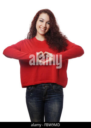 Girl making heart shape avec ses mains Banque D'Images