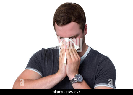 Young Man Blowing Nose Banque D'Images