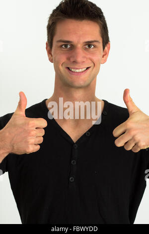 Happy smiling man doing two Thumbs up Banque D'Images
