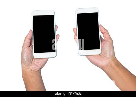 Businesswoman holding smartphone dans chaque mains Banque D'Images