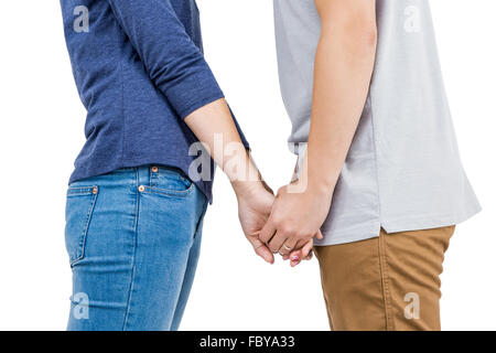 Mid section of couple holding hands Banque D'Images