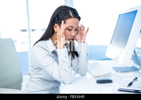 Of Asian businesswoman with hands on face Banque D'Images