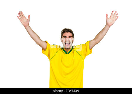 Portrait of handsome man with arms raised Banque D'Images