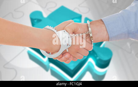 Image composite de menotté business people shaking hands Banque D'Images