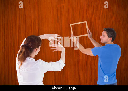 Image composite du couple de décider de suspendre photo Banque D'Images