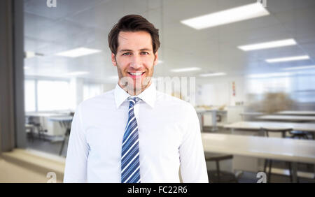 Portrait of businessman standing with hands in pockets Banque D'Images