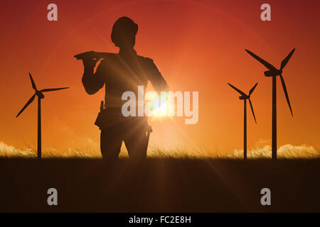 Composite image of worker carrying wooden planks Banque D'Images