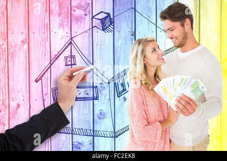 Image composite de beau couple clignoter leur paiement Banque D'Images