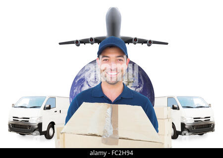 Composite image of delivery man holding cardboard box Banque D'Images