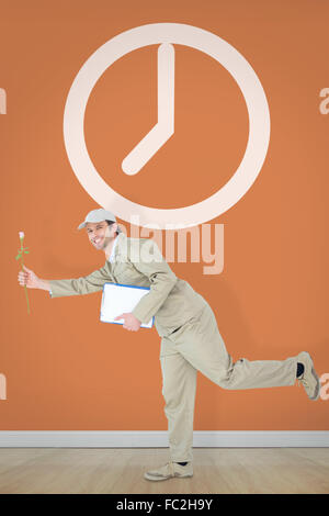 Composite image of delivery man with clipboard fleur offrant Banque D'Images