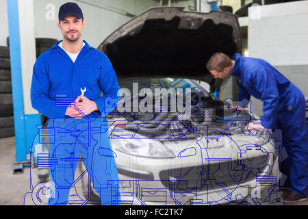 Portrait of male mechanic holding spanner Banque D'Images