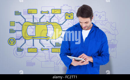 Image composite de mechanic using digital tablet over white background Banque D'Images