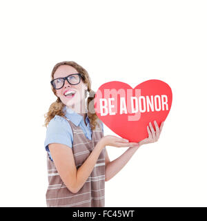 Image composite de hipster geek woman holding heart card Banque D'Images