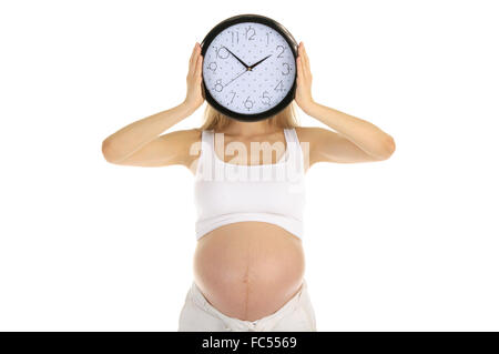 Femme enceinte est titulaire de la tour de l'horloge Banque D'Images