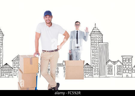 Composite image of delivery man leaning on trolley de boîtes Banque D'Images